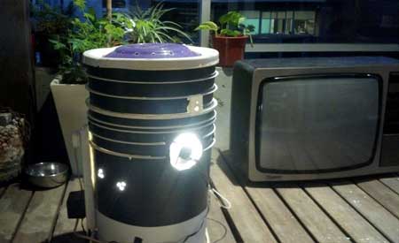 Cannabis space bucket glowing next to a TV