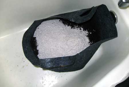 Pour half bag of perlite on top