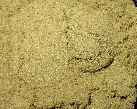 This is the 220 Micron dry ice hash. Low quality with lots of green matter, but still usable for some purposes (like in a joint).