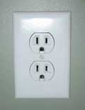 An electrical outlet - "grams/watt" is not necessarily a good measure for electricity used since it doesn't take light hours into account