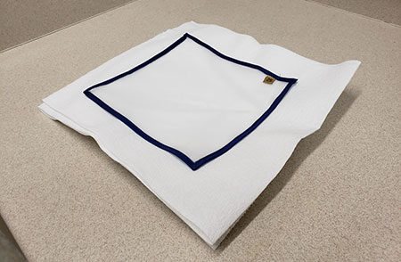 A 25-micron drying sheet on stacked paper towels