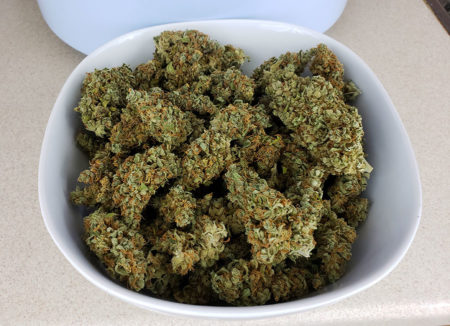 A white bowl containing 2 ounces of cannabis