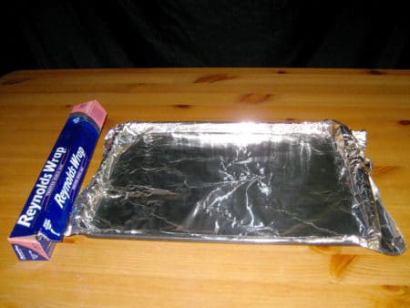 A baking sheet lined with aluminum foil