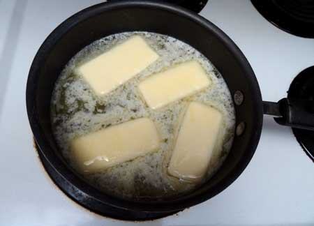 Add butter to the water on the stove top for this cannabutter recipe