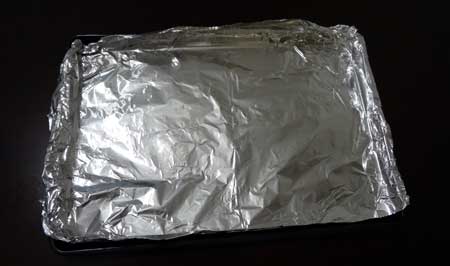 Line a baking sheet with aluminum foil so the cannabis buds won't stick to your pan.