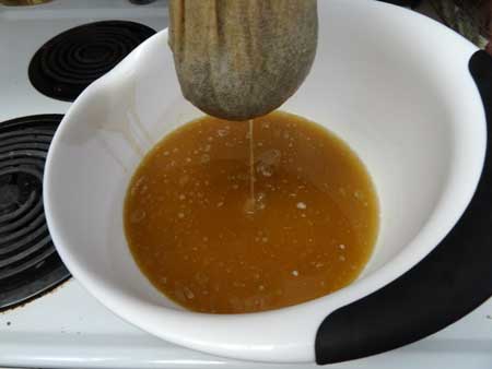 Wring out the butter through the cheese cloth for this step in the canna butter recipe