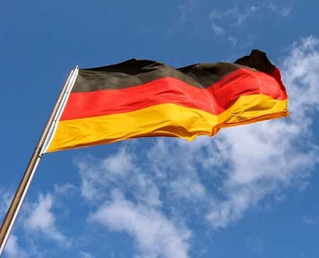 German flag flying proud. Learn more about cannabis cultivation legalization in Germany in this tutorial.