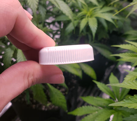 A small piece of plastic can make a helpful incline so water pools forward.