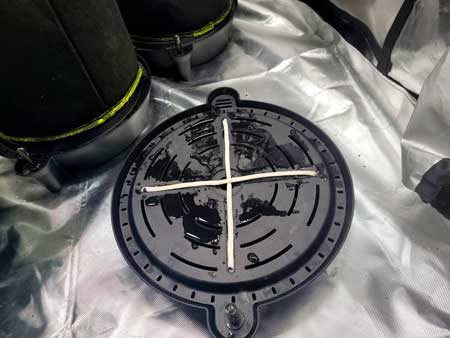 Bottom of AC Infinity auto-watering pot base - cannabis wicking seems to be working - GrowWeedEasy.com 