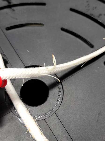 Roots growing into rope of the AC Infinity auto-watering pot bases - Grow Weed Easy cannabis grow journal