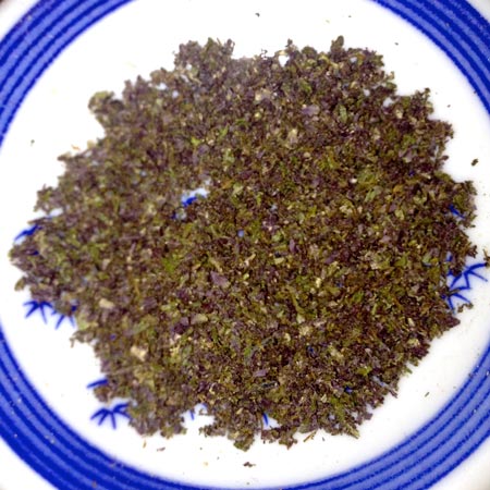 Example of purple cannabis buds after being ground up